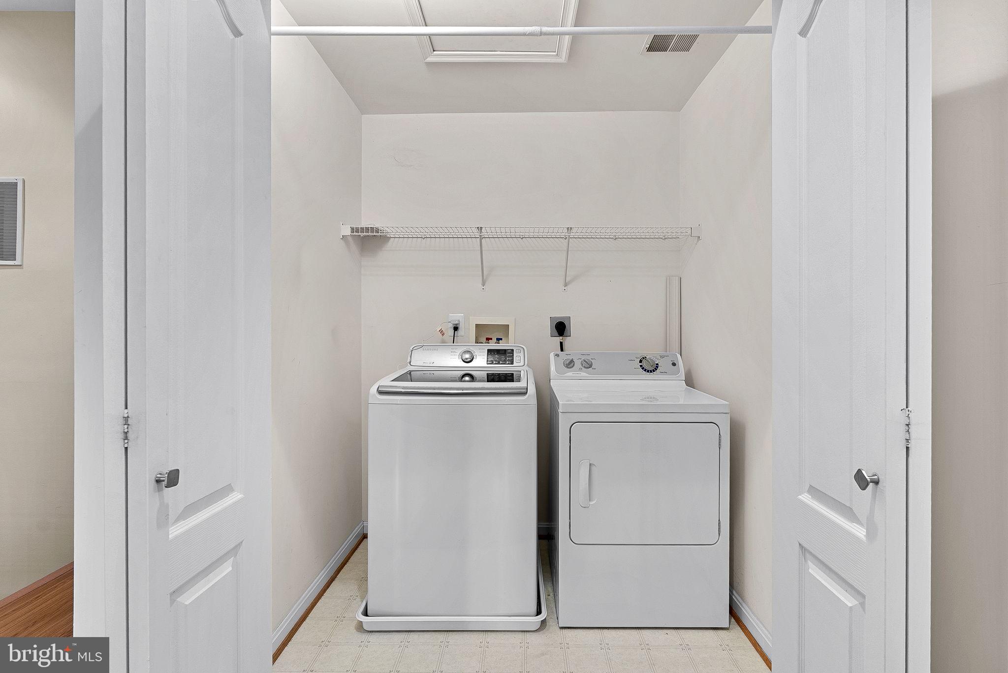 13574 Big Boulder Road Herndon, VA 20171 - Photo 42 of 45 a utility room with dryer and washer