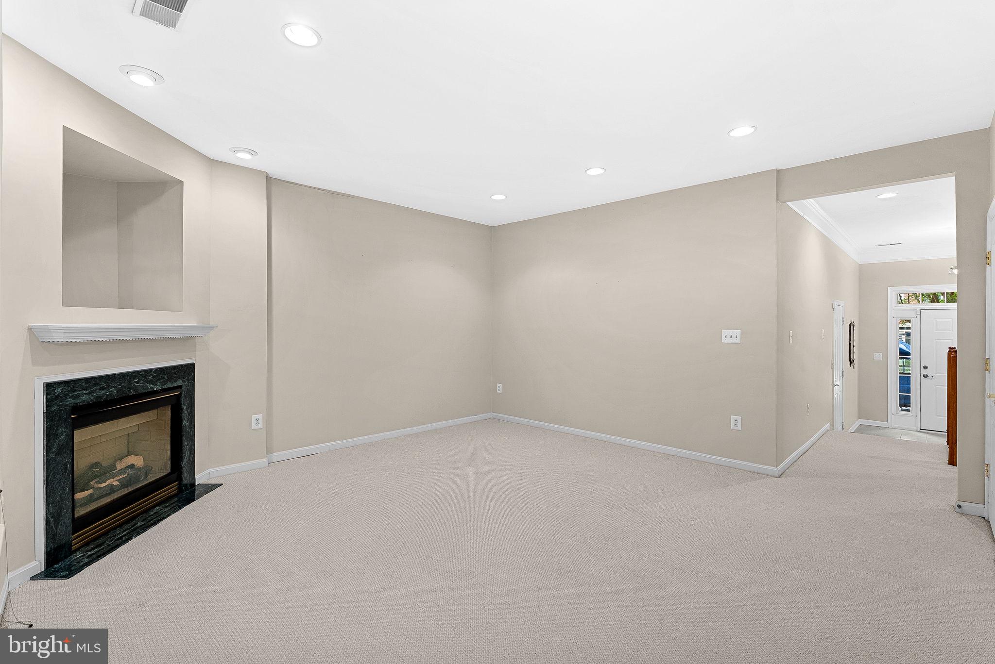 13574 Big Boulder Road Herndon, VA 20171 - Photo 6 of 45 a view of an empty room with a fireplace