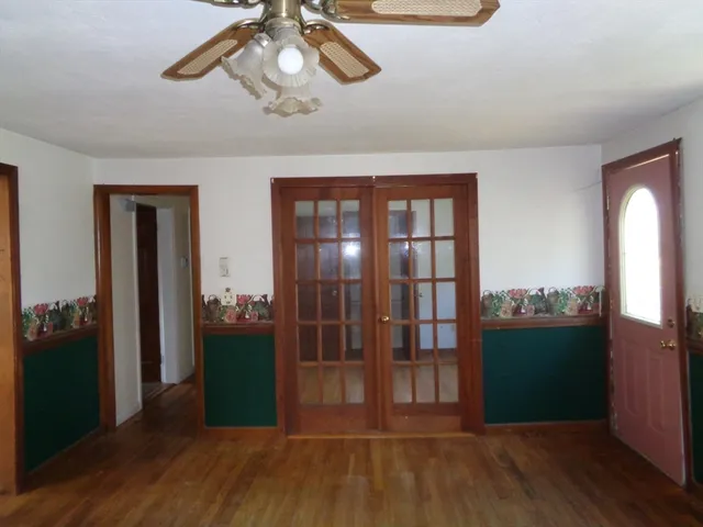 a view of a livingroom with furniture and hardwood floor
