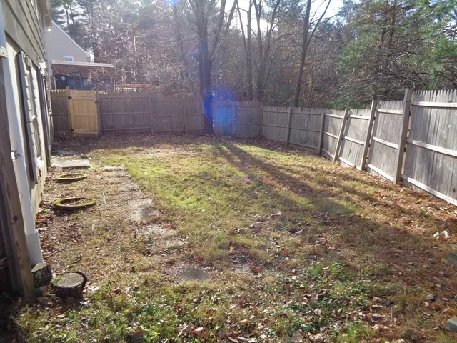 a view of a backyard of the house