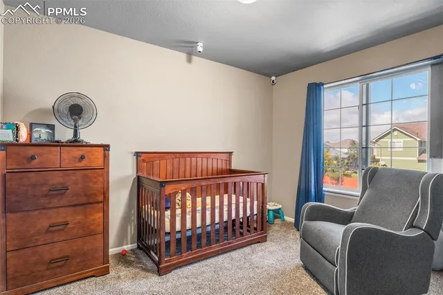 a bedroom with furniture and a window