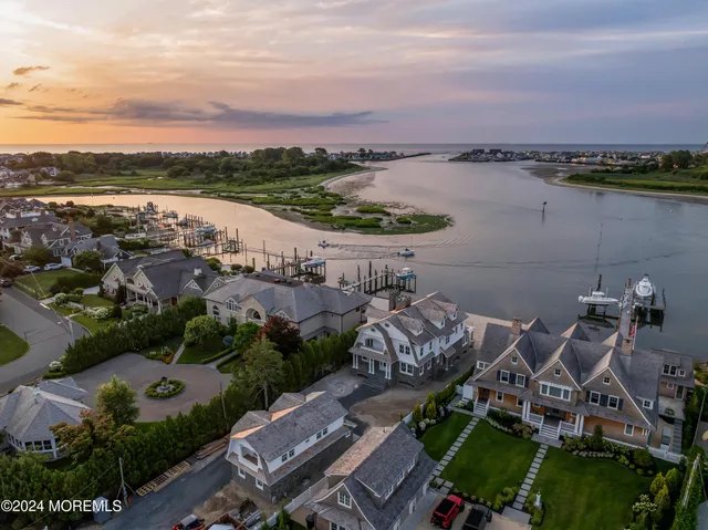 an aerial view of a house with a lake view