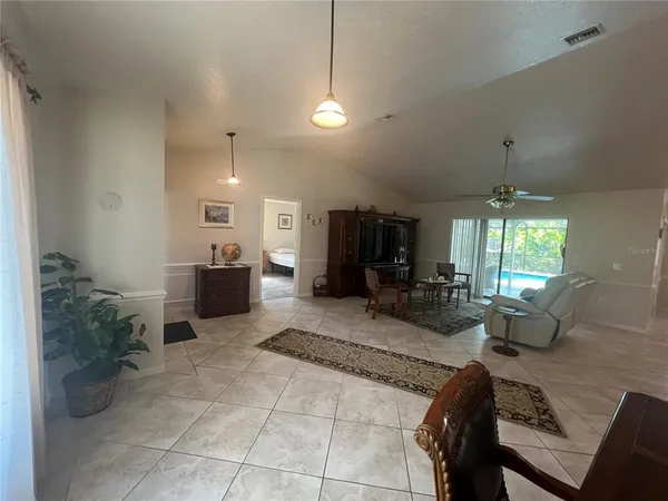 a living room with furniture a window and appliances