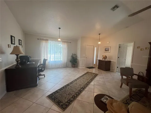 a living room with furniture window and a table