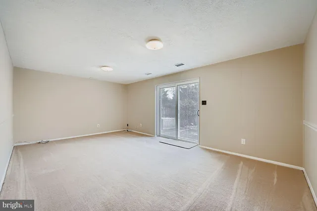 an empty room with a bathroom