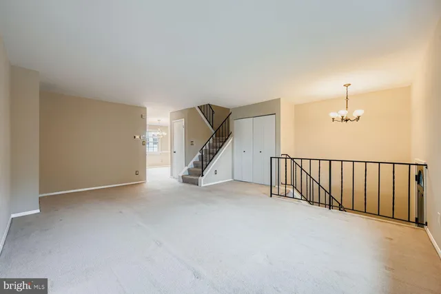 a view of an empty room with stairs