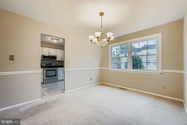 a kitchen with cabinets stainless steel appliances and a sink