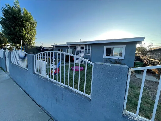 a view of balcony with deck and yard
