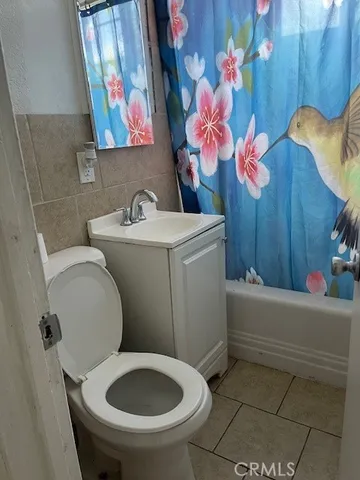 a bathroom with a toilet sink and tub
