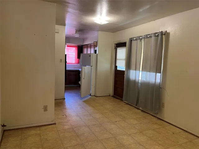 a view of a hallway with an empty room