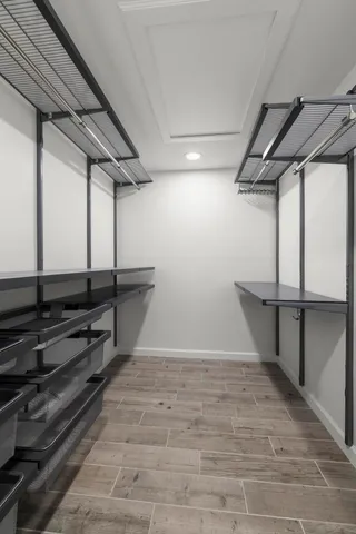 an aerial view of residential houses with outdoor space and lake view