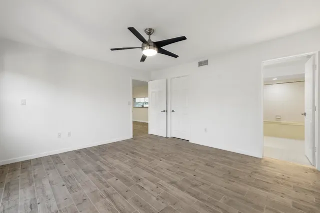 an aerial view of residential building and lake