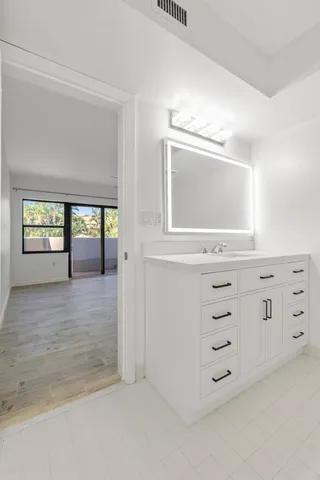 an aerial view of residential houses with city view