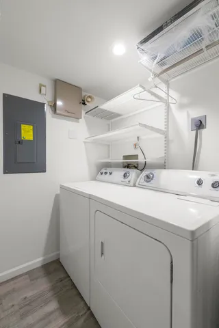 an aerial view of a houses with a swimming pool