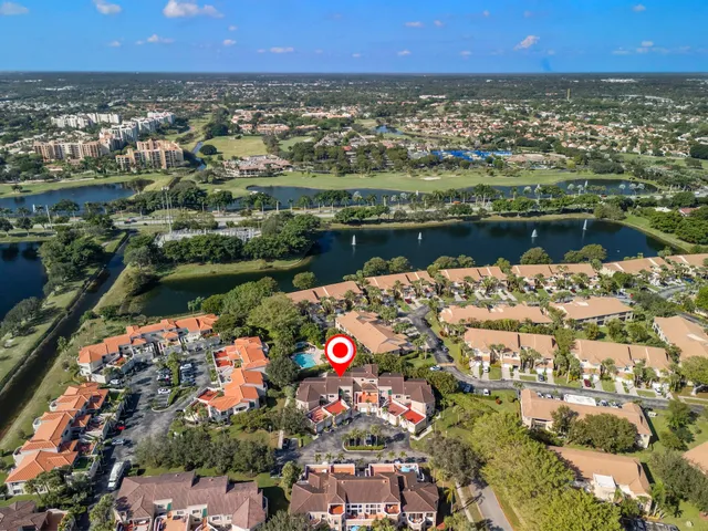 a view of a park with large trees