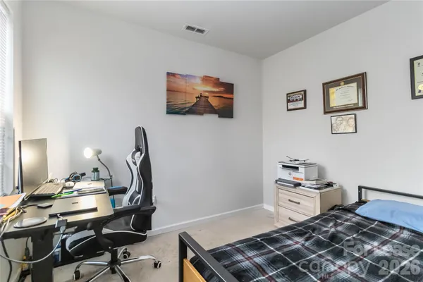 a bedroom with furniture and a bed