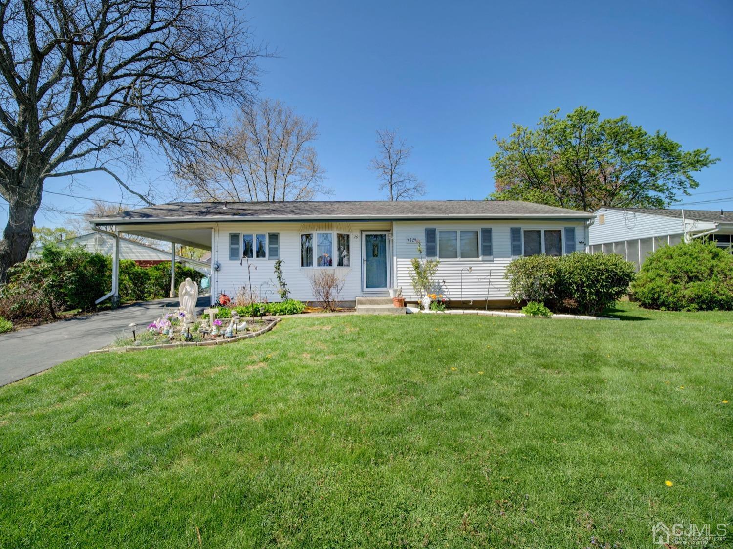 19 Purdue Road Old Bridge, NJ 08859 - Photo 1 of 21 a view of a house with backyard sitting area and garden