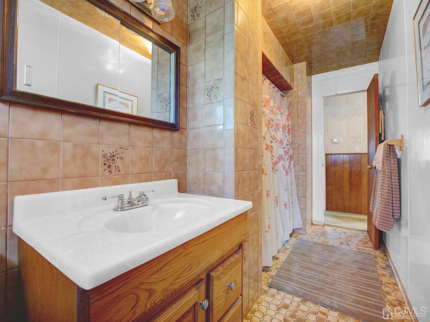 19 Purdue Road Old Bridge, NJ 08859 - Photo 13 of 21 a bathroom with a sink a shower and a mirror