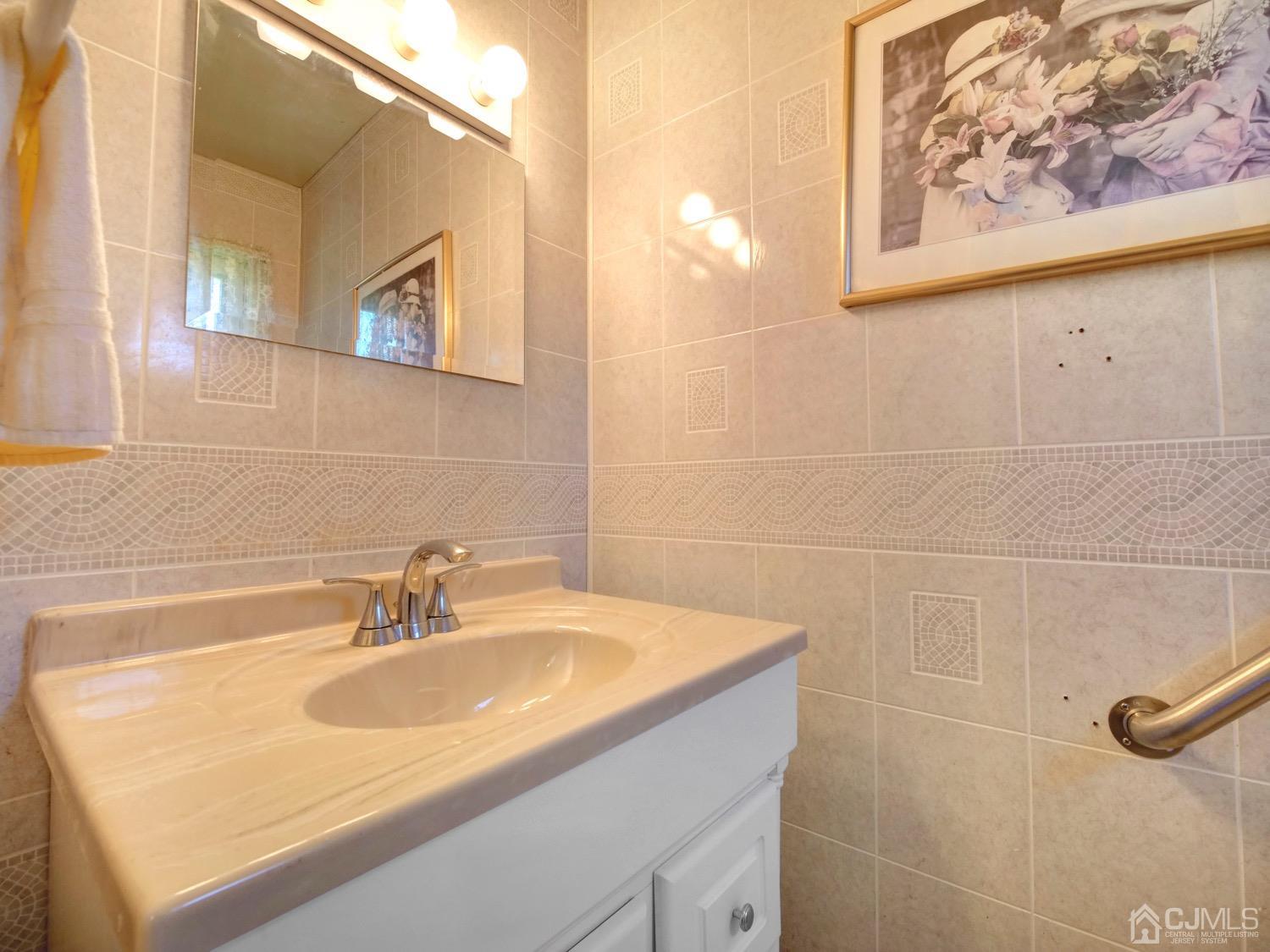 19 Purdue Road Old Bridge, NJ 08859 - Photo 15 of 21 a bathroom with a sink and a mirror