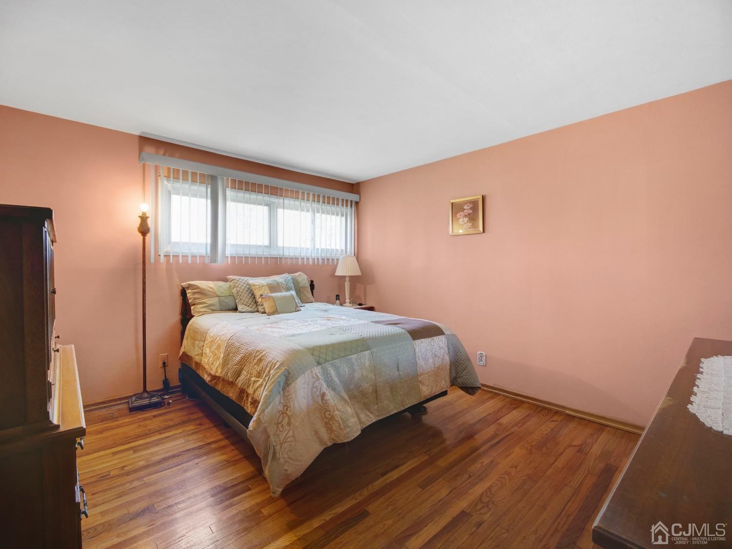 19 Purdue Road Old Bridge, NJ 08859 - Photo 16 of 21 a bedroom with a bed and wooden floor