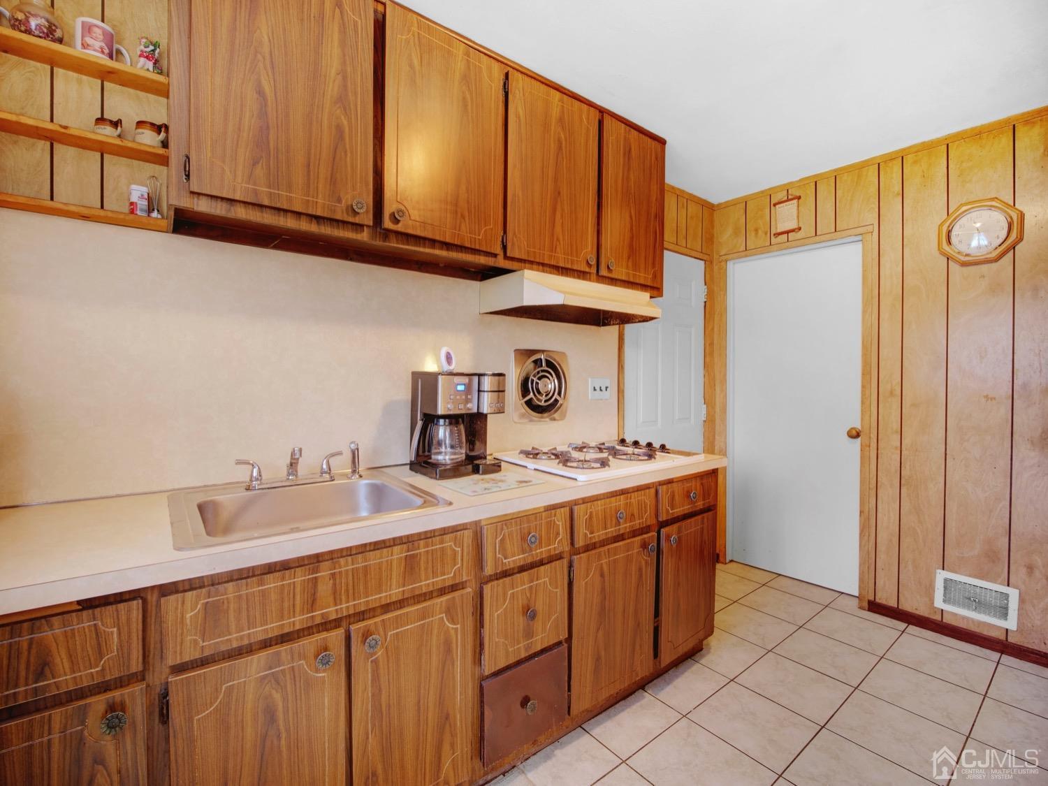 19 Purdue Road Old Bridge, NJ 08859 - Photo 20 of 21 a kitchen with stainless steel appliances granite countertop a sink stove and cabinets