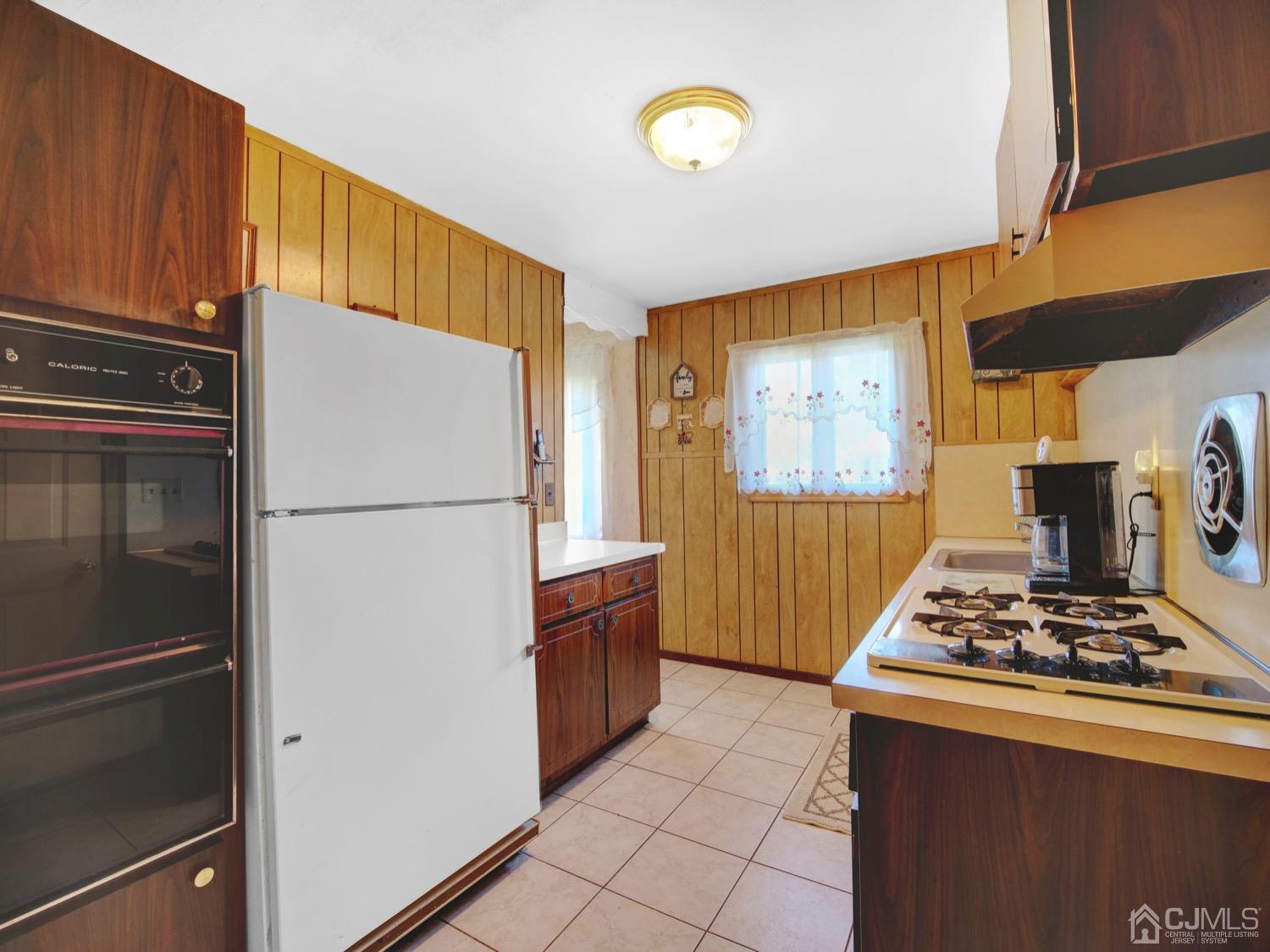 19 Purdue Road Old Bridge, NJ 08859 - Photo 21 of 21 a kitchen with stainless steel appliances granite countertop a refrigerator and a stove