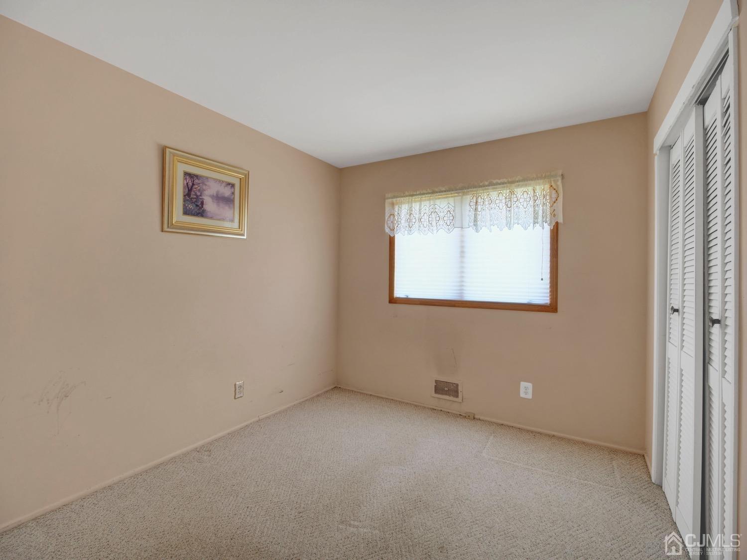 19 Purdue Road Old Bridge, NJ 08859 - Photo 9 of 21 an empty room with windows