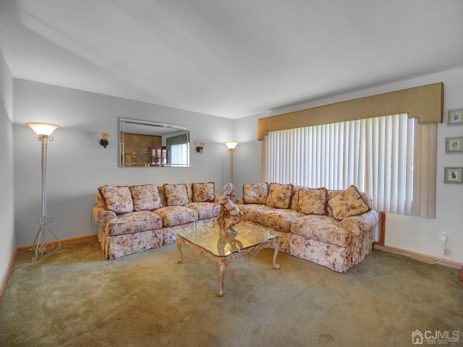 19 Purdue Road Old Bridge, NJ 08859 - Photo 10 of 21 a living room with furniture and a large window