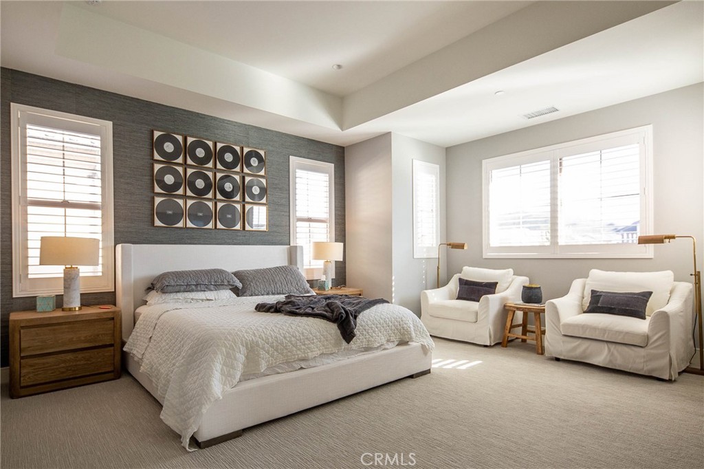 119 Wheatgrass Irvine, CA 92618 - Photo 12 of 32 a spacious bedroom with a bed and a couch