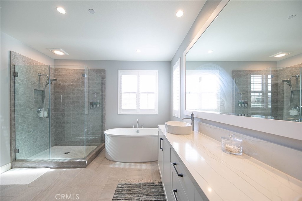 119 Wheatgrass Irvine, CA 92618 - Photo 13 of 32 a bathroom with a double vanity sink toilet and shower