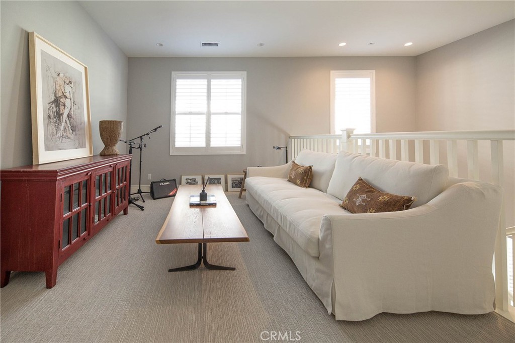 119 Wheatgrass Irvine, CA 92618 - Photo 16 of 32 a living room with furniture and a window