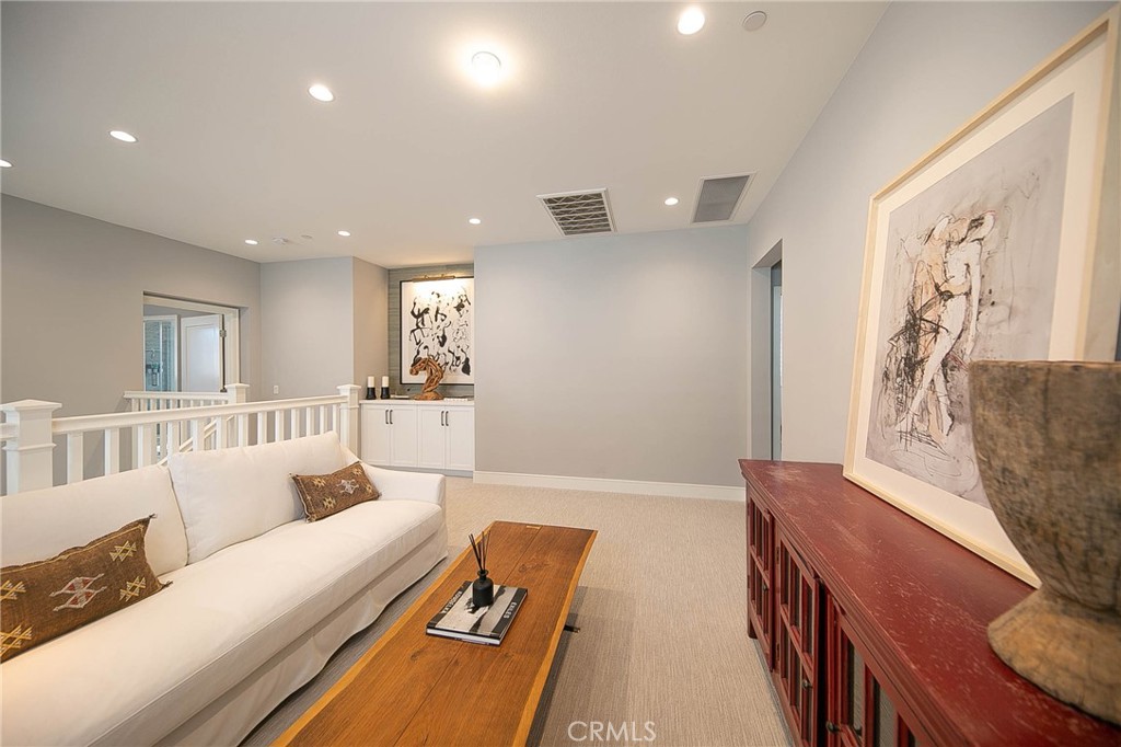 119 Wheatgrass Irvine, CA 92618 - Photo 17 of 32 a living room with furniture and a wooden floor