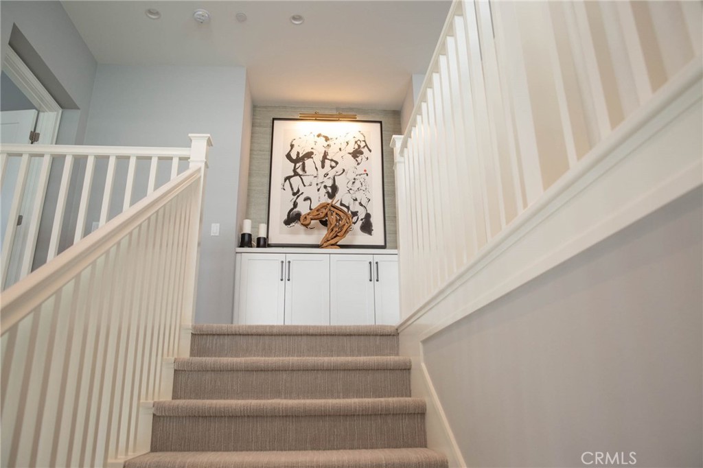 119 Wheatgrass Irvine, CA 92618 - Photo 18 of 32 a view of staircase with white walls and a window