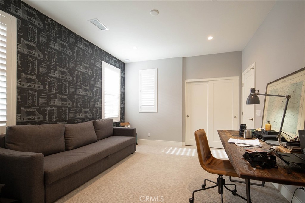 119 Wheatgrass Irvine, CA 92618 - Photo 19 of 32 a living room with furniture and a large window