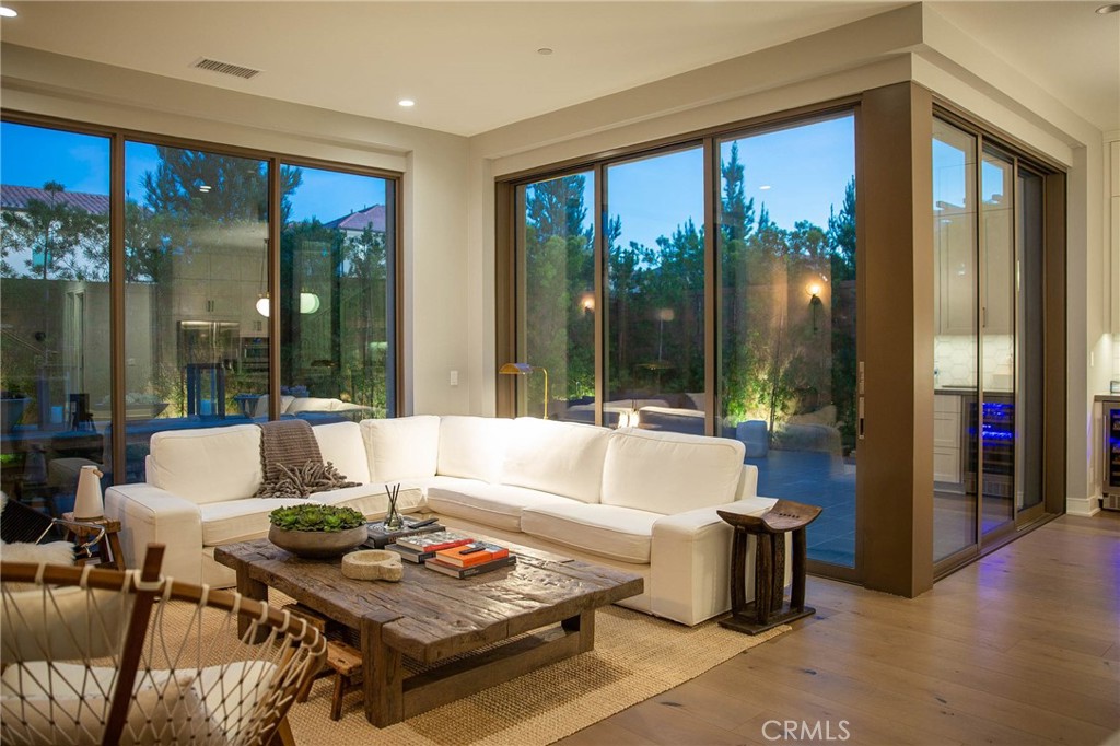 119 Wheatgrass Irvine, CA 92618 - Photo 24 of 32 a living room with furniture and a large window