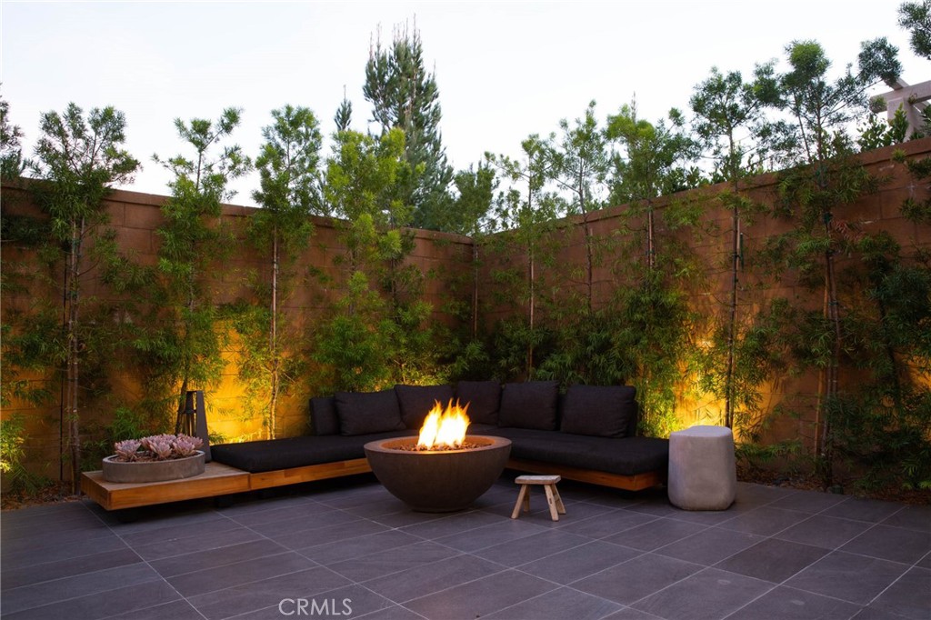 119 Wheatgrass Irvine, CA 92618 - Photo 26 of 32 a view of a patio with couches and potted plants