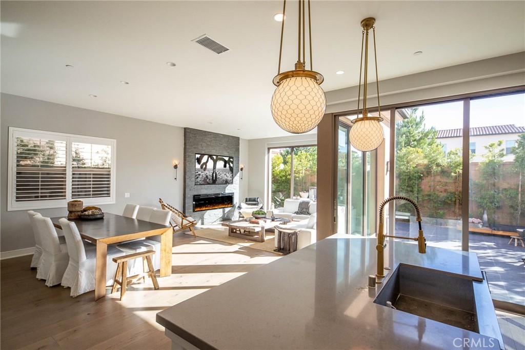 119 Wheatgrass Irvine, CA 92618 - Photo 4 of 32 a living room with furniture and floor to ceiling windows
