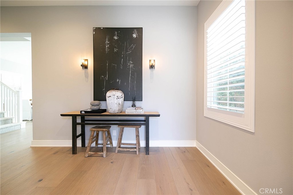 119 Wheatgrass Irvine, CA 92618 - Photo 10 of 32 a room with chair table and a window