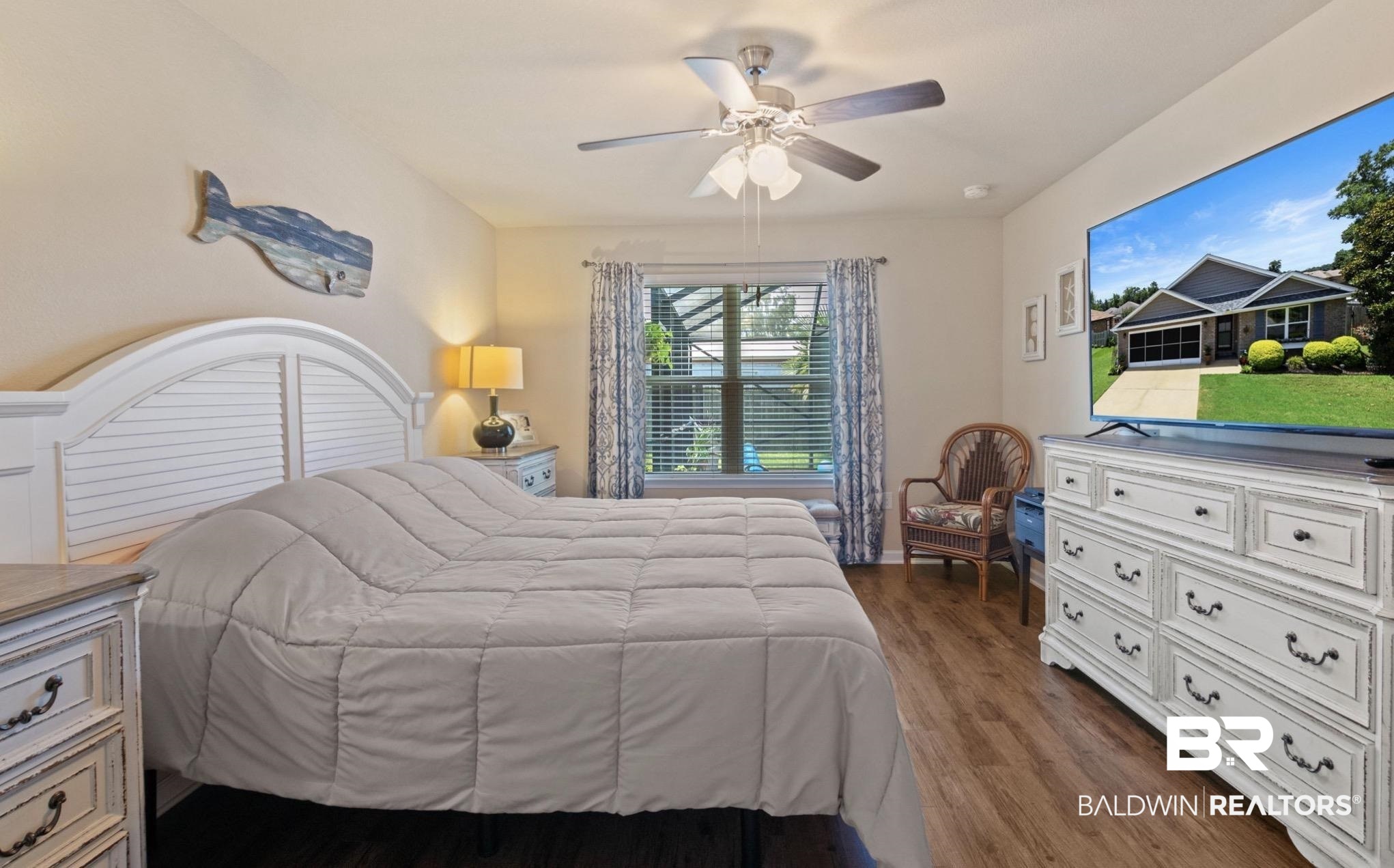 1676 Abbey Loop Foley, AL 36535 - Photo 14 of 31 Spacious room featuring wood-finish flooring and a ceiling fan with integrated lighting