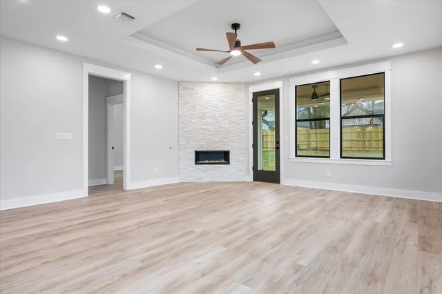 a view of an empty room with a kitchen