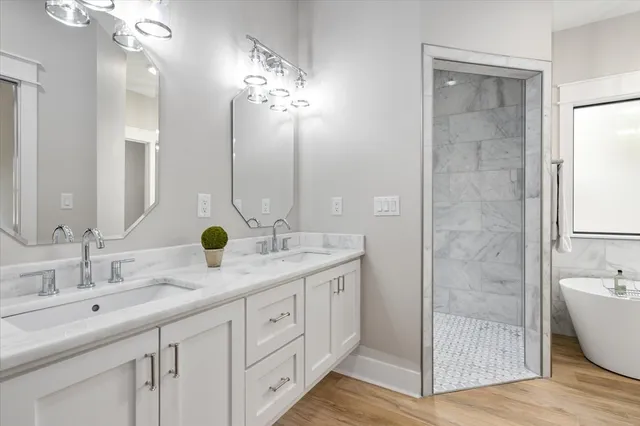 a bathroom with a bathtub and shower
