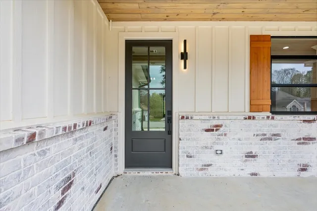a view of a bathroom with a sink and window