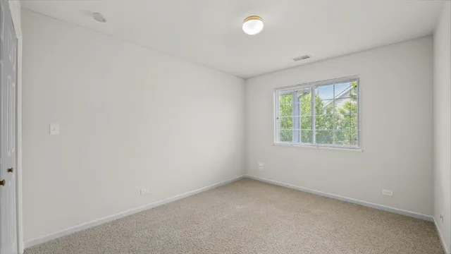 a bathroom with a granite countertop sink a toilet a mirror a bathtub and shower
