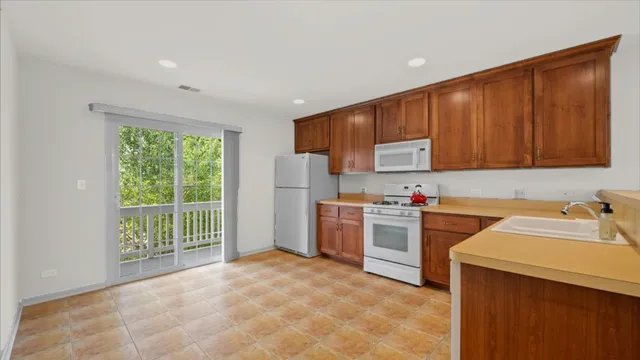 a kitchen with a sink cabinets and appliances