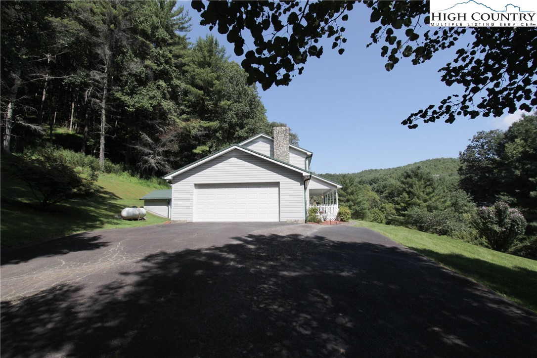 581 North Fork New River Road Lansing, NC 28643 - Photo 6 of 44 a view of a house with a street