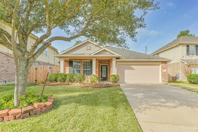 a front view of a house with a yard and porch