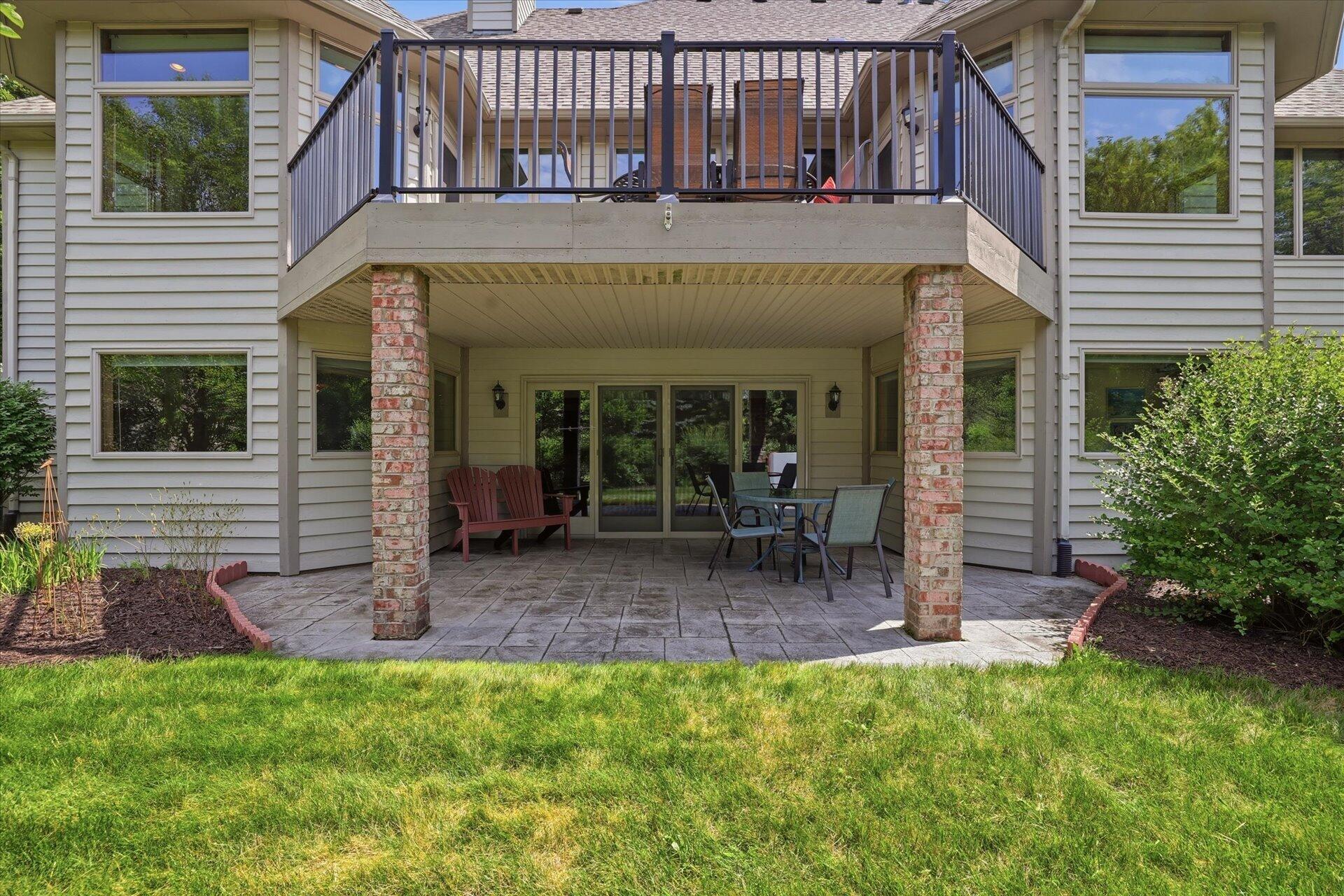 W330-s1417 County Rd C Delafield, WI 53018 - Photo 13 of 39 Enjoy the outdoors anytime under the covered stamped concrete patio