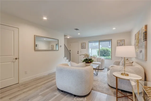 a bedroom with a bed and a night stand