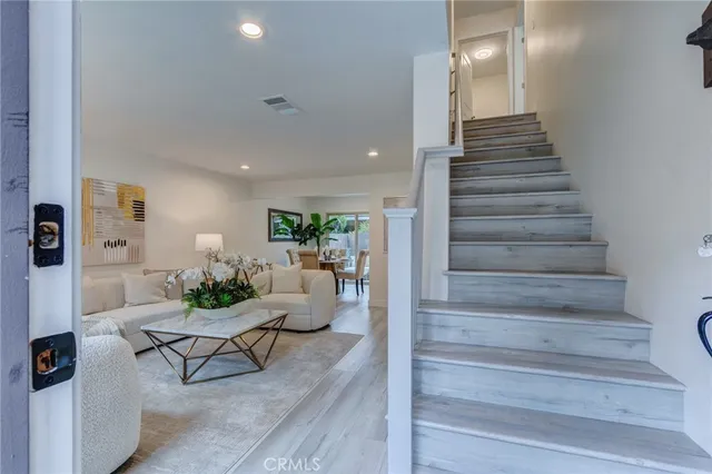 a kitchen with stainless steel appliances kitchen island granite countertop a stove a sink and a microwave