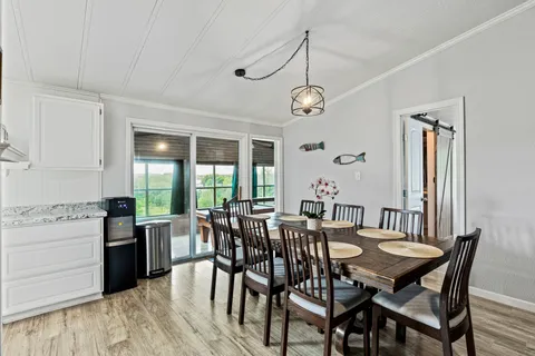 a kitchen with stainless steel appliances a refrigerator sink and microwave